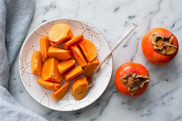 Who can't eat persimmons and why?